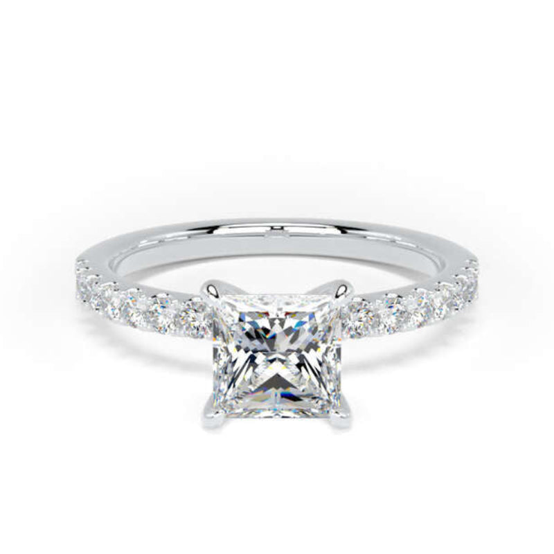A princess-cut diamond engagement ring with a silver-colored band set with small diamonds, centered on a plain white background.
