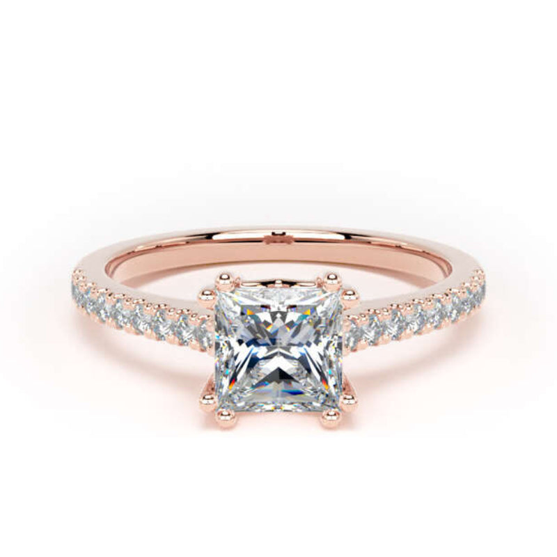 A rose gold engagement ring featuring a princess-cut clear center stone and a pavé band with small round stones, set against a plain white background.