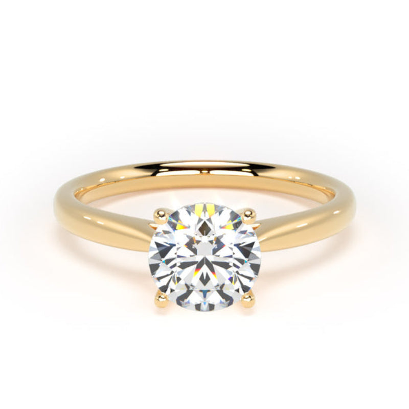 A classic solitaire engagement ring featuring a round brilliant-cut diamond set in a polished yellow gold four-prong setting, on a clean white background.