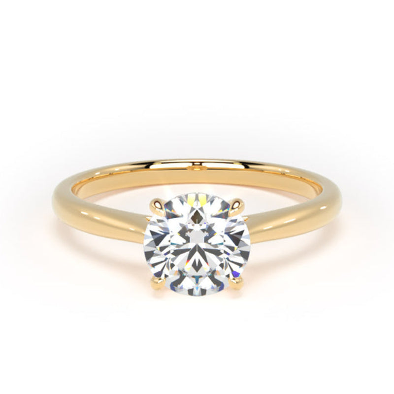 A classic solitaire engagement ring featuring a round brilliant-cut diamond set in a polished yellow gold band, shown against a plain white background.