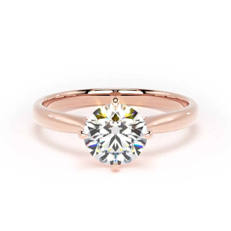 A rose gold solitaire engagement ring with a round brilliant-cut diamond center stone, shown on a clean white background.