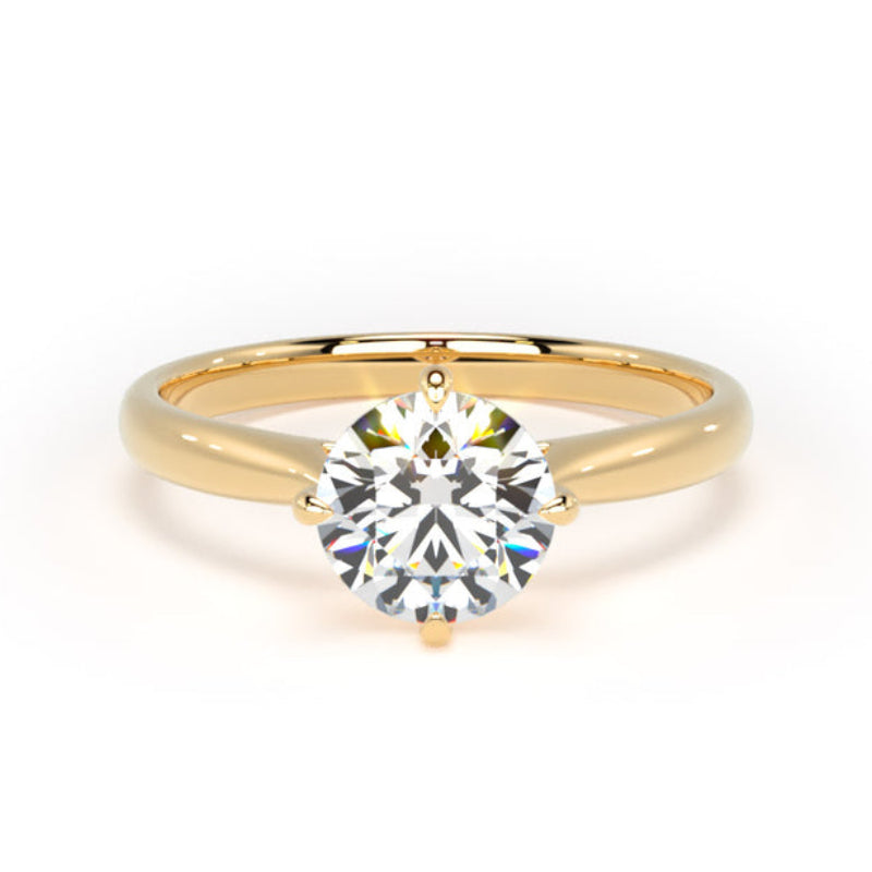 A yellow gold solitaire engagement ring with a round brilliant-cut diamond center stone, shown on a clean white background.