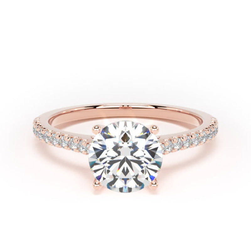 Rose gold ring with a large diamond and smaller diamonds on the band against a white background